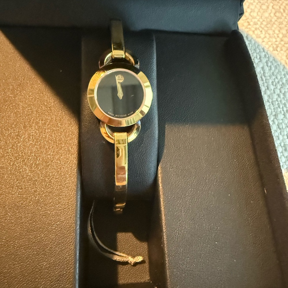 Movado Gold Tone women watch with box and extra links